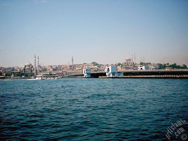 View of (from left) Yeni Cami (Mosque), (at far behind) Beyazit Mosque, Beyazit Tower, Galata Brigde and Suleymaniye Mosque from the shore of Karakoy in Istanbul city of Turkey.
