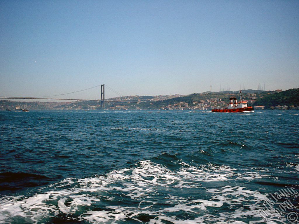 View of Uskudar coast and Bosphorus Bridge from the Bosphorus in Istanbul city of Turkey.
