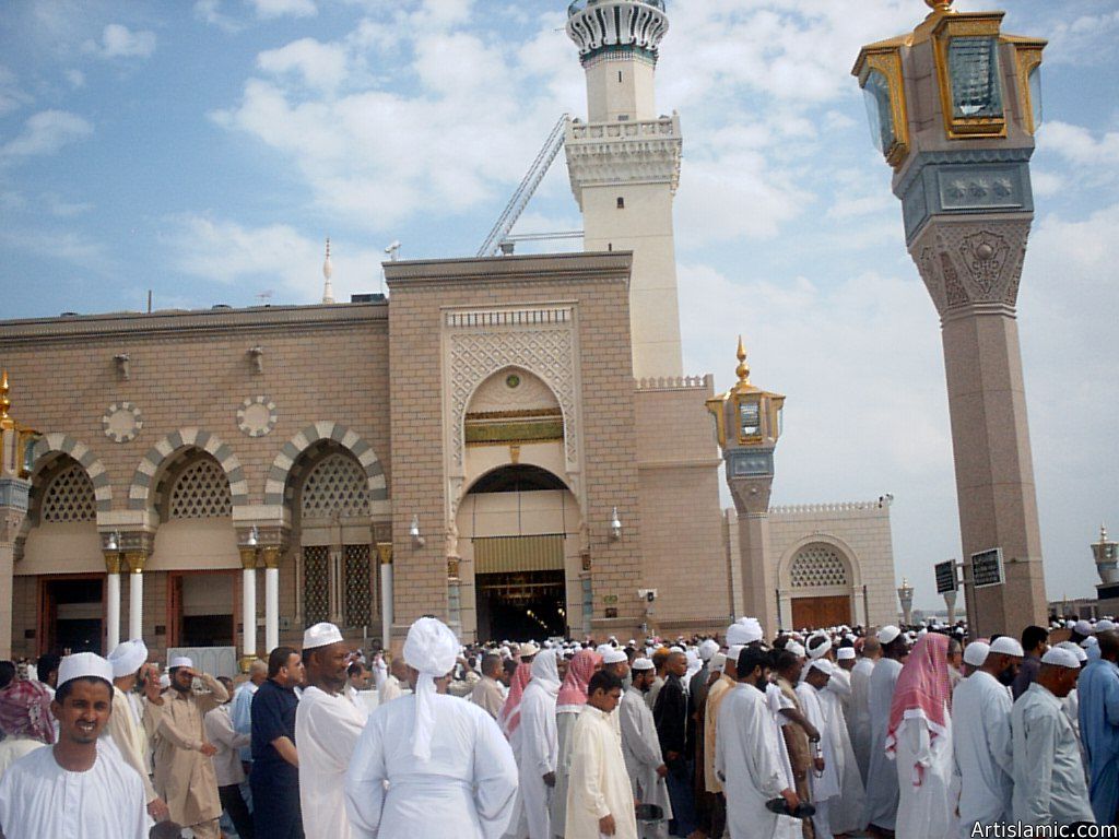 The Prophet Muhammad`s (saaw) Mosque (Masjed an-Nabawe) in Madina city of Saudi Arabia and the muslims going out of mosque after a prayer time.
